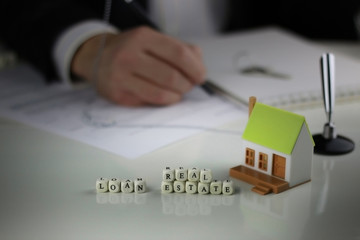 House Agents hands a contract loan mortgage
