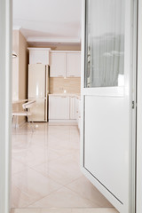 Modern, bright, clean kitchen interior in a luxury house. Interior design with classic or vintage elements. Practical and well-furnished kitchen.