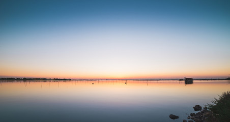 Fototapeta premium Calm sunset at a laguna in italy