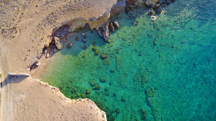 Aerial drone photo of famous caves of Ksylobatis near Pori beach, Koufonissi island. Cyclades, Greece