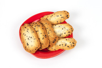 Home made a small sweet cookie with black sesame, typically round, flat, and crisp.Cookie on white.