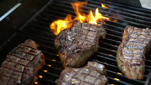 High quality video of steaks on the fire in real 1080p slow motion 120fps