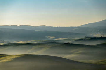 Tuscany landscape in the morning fog