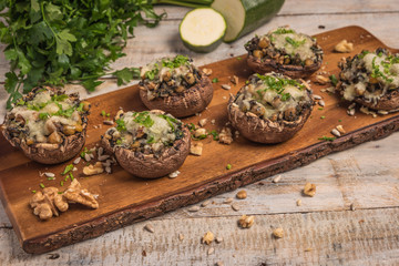 Mushroom caps stuffed with vegetables and cheese