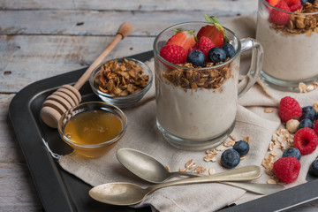 Breakfast parfait with homemade granola, fresh fruits and yogurt