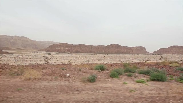 View of the rocky desert with a car window, Mountain desert panorama