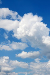 Blue sky with clouds on a sunny day.