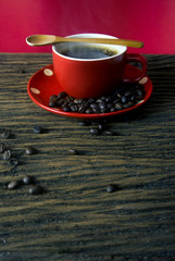 red hot coffee cup with wood spoon