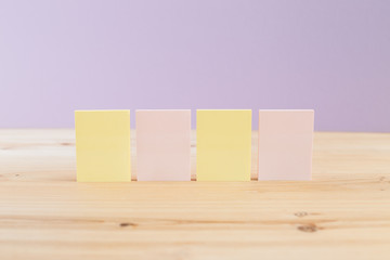 color blank sticky notes on wooden desk