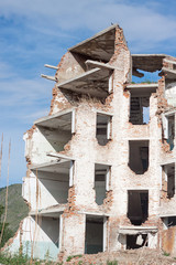 The old destroyed brick multi-storey building