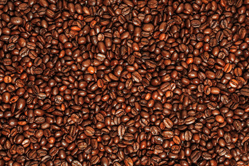 Dark many roasted coffee beans texture background