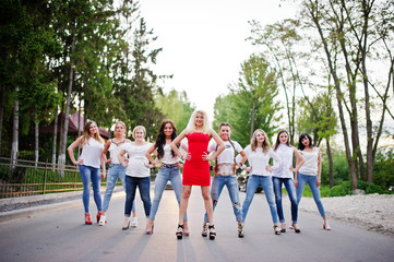 Obraz premium Girls having fun while posing outside in the park on the bachelorette party.