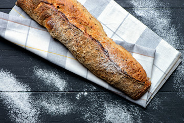 Baguette with flour around.