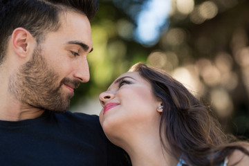 Fototapeta premium Young couple looking at each other smiling