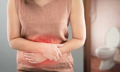 The woman wake up for go to restroom. People with diarrhea problem concept
