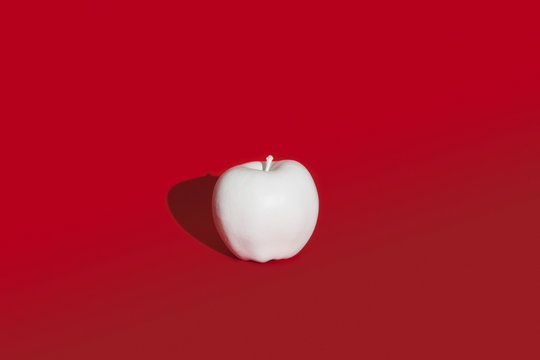 Naklejki Apple painted white on red background