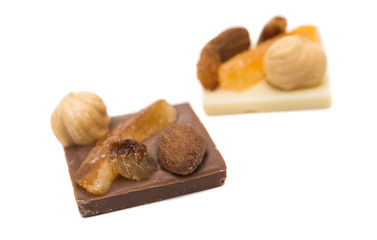 Chocolate with nuts and raisins isolated