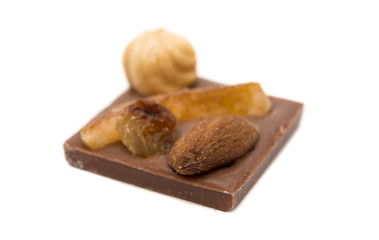 Chocolate with nuts and raisins isolated