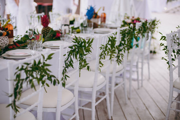 Fototapeta na wymiar Decoration of chairs at the wedding