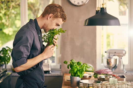 Chef smelling fresh herbs