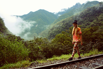 young blonde woman walking at mountains in jungle, Peru