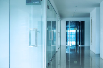 Modern office interior, Blue toned, selective focus on doorknob