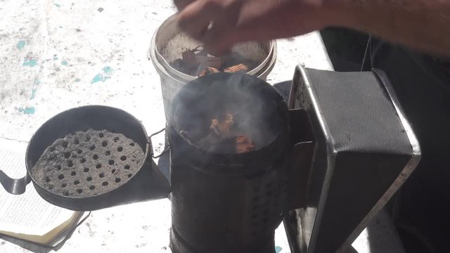 Open and smoke bee smoker. Beekeeping tools. Cllose up top view footage.