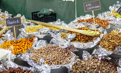 Big choice of nuts and fruits on a market for Portuguese specialties in Lisbon