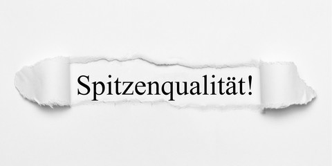 Spitzenqualität! auf weißen gerissenen Papier