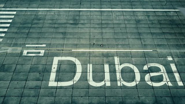 Aerial view of big airplane arriving to Dubai airport. Travel to United Arab Emirates conceptual intro animation