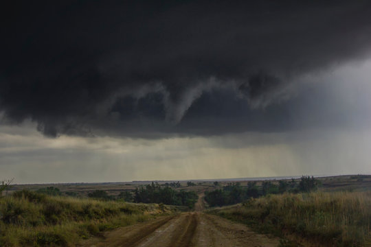 Rotating funnel cloud over rural road, McLean, Texas, United States, North America