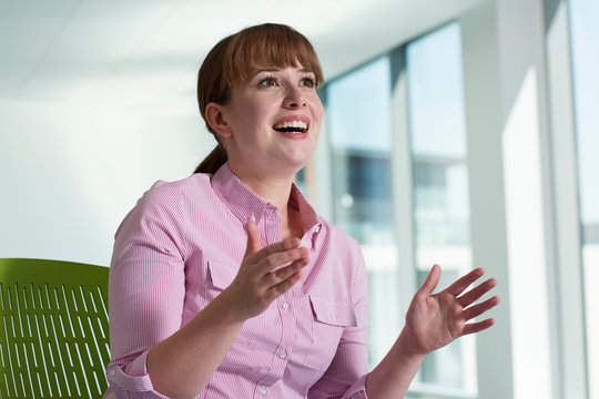 Portrait of businesswoman, gesticulating in conversation