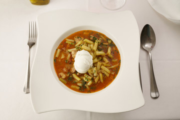 Runner bean soup arranged in a plate, Traditional dish in elegant setting, Selective focus with soft light