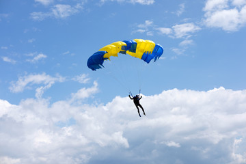 paraplane in blue cloudy sky
