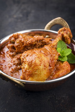 Traditional Indian Chicken Tikka Masala as close-up in a Korai