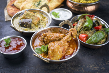Traditional Indian Curries and Biryani with Mango Chutney and Pita Bread as top view