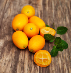 Kumquats on a wooden table