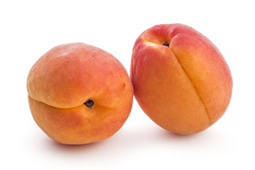 Fototapeta na wymiar Fresh ripe organic apricots isolated on a white background