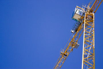 Fototapeta na wymiar Lifting crane in the sky