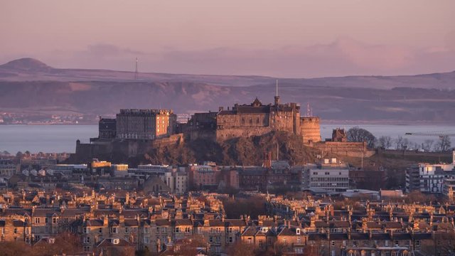 4K Time-Lapse of the Edinburgh Castle Rock at Sunrise with the Firth of Forth at the back. Scotland, UK