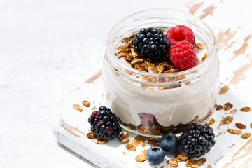 healthy creamy dessert with fresh berries in jar