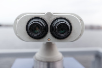 Binoculars controlled by coins