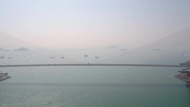 Hong Kong Aerial v105 Flying low over Stonecutters Bridge out to sea