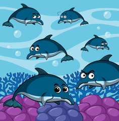 Obraz na płótnie Canvas Blue dolphins swimming underwater