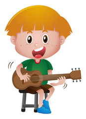 Little boy playing guitar