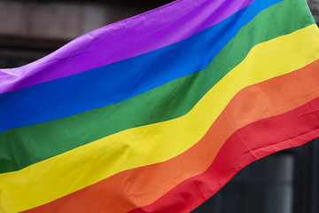 Gay rainbow flag at an LGBT gay pride march in London