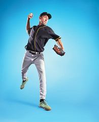 The one caucasian man as baseball player playing against blue sky