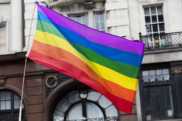 Gay rainbow flag at an LGBT gay pride march in London