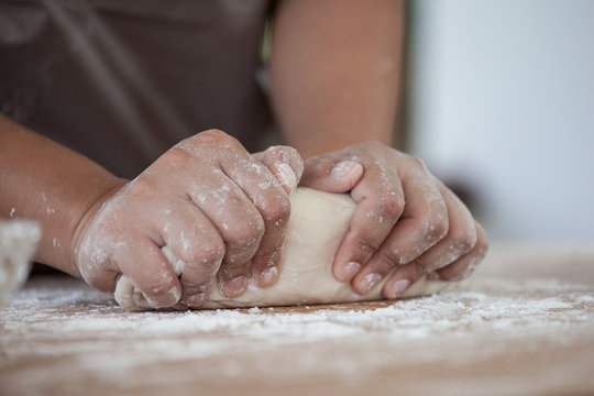 Woman hands kneading dough prepare for baking cookies in the kitchen