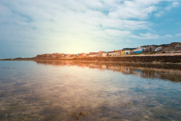 scenic view of beach houses reflected on water